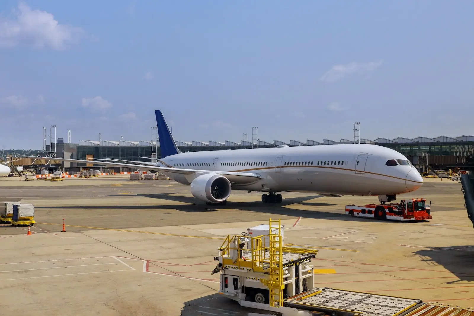Wide-body aircraft on the tarmac at an international airport gate